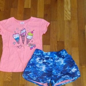 girl med drifit shorts and graphic tee